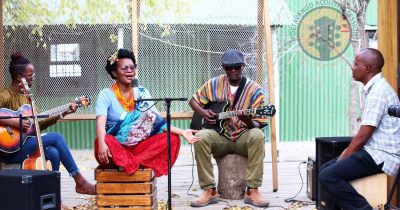 Musicians performing at a Poetavango acoustic session