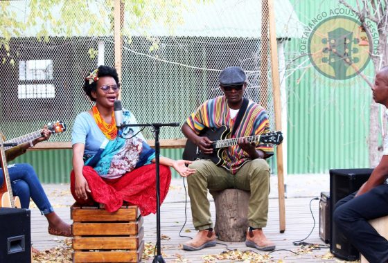 Musicians performing at a Poetavango acoustic session
