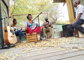 Musicians performing an intimate acoustic session for Poetavango
