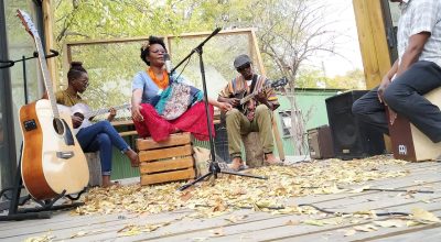 Musicians performing an intimate acoustic session for Poetavango
