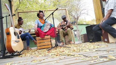 Musicians performing an intimate acoustic session for Poetavango