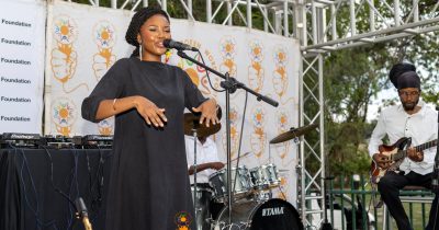 A performer reciting spoken word at Poetavango